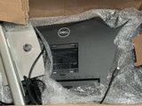 a dell laptop in a box with some wrapping on it