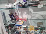 a lot of video games on display in a glass case