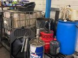 a cart full of water bottles and other items in a garage