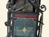 a metal frame with a stained glass window on it