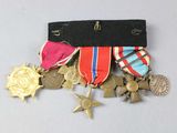 a lot of medals that are on the table