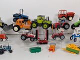 many different types of toy vehicles on display on a table