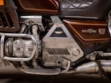 a close up of a motorcycle parked in a garage