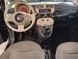a dashboard of a small car with a steering wheel