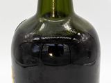 a bottle of wine that is sitting on a table