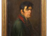 portrait of a young man in a green coat and red scarf