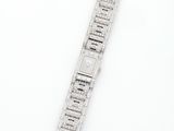 a close up of a watch on a white surface with a white background