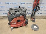 an image of a red and black machine and a silver object