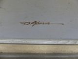 a close up of a white plate with a brown writing on it