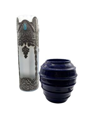 two vases that are next to each other on a table