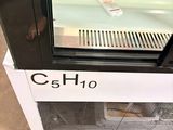 a glass display case with a clock on it