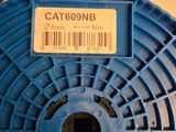 a close up of a blue spool with a barcode on it