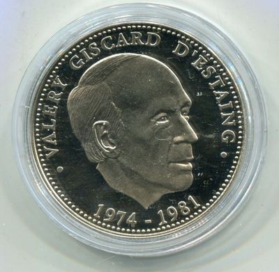a close up of a coin on a white surface