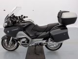 a picture of a black and silver motorcycle parked in a garage