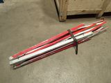 a pair of skis laying on the floor next to a box
