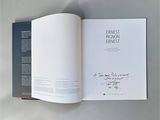 an open book with a picture of a person on it