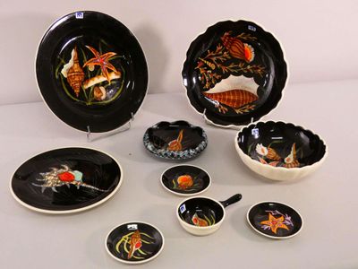 a lot of plates and bowls that are on the table