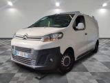 the white van is parked on a checkered floor in a room