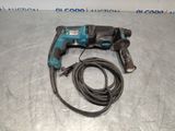 a corded drill is laying on the floor next to a cord
