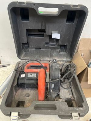 a tool in the case that is sitting on the floor