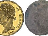 a close up of a coin on a white surface