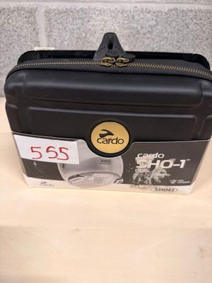 a black suitcase sitting on a counter with a price tag on it