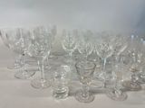 a lot of wine glasses sitting on a table