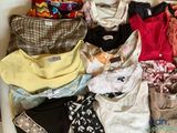 a lot of clothes that are sitting in a box
