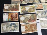 a lot of different bank notes on the table