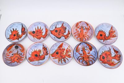 six plates with different designs on them on a table
