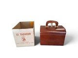 pair of leather suitcases sitting next to each other on a white surface