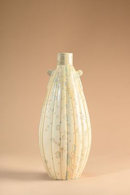 a white vase that is sitting on a table