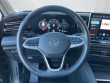 the interior of a volkswagen vehicle with a steering wheel and dashboard controls