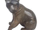 statue of a cat sitting on its hind legs on a white background