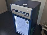a small refrigerator that is sitting on the floor