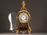 a clock that is sitting next to a mirror