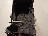 a black cart with a black cover on it