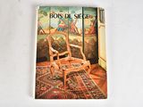 a book with a picture of a rocking chair on the cover