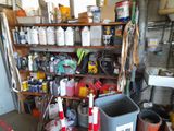 a garage with a lot of tools and supplies on the shelves