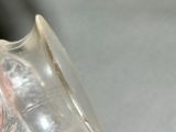 a person holding a glass of water in their hand