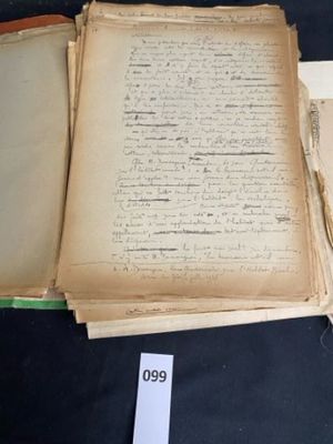 several old books are stacked on top of each other on a table
