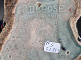 a close up of a vase with a sticker on it