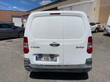 a white van that is parked in a parking lot