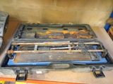 a tool case with tools inside of it on a table