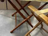a small folding table with a striped cloth on it