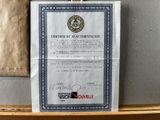 a certificate that is on a shelf in a room