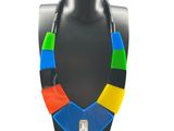 a multicolored necklace on a mannequin display
