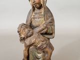 an image of a statue of a woman holding a baby