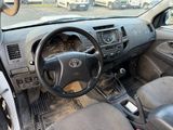a dashboard of a car with a steering wheel and dashboard controls