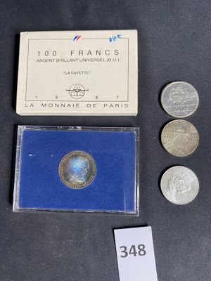 a small box of coins sitting on a table next to a coin